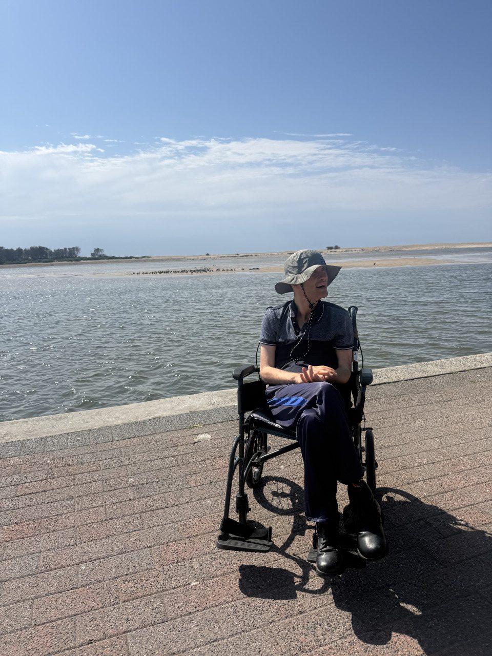 A Trieste Foundation participant enjoying the waterfront on a sunny day