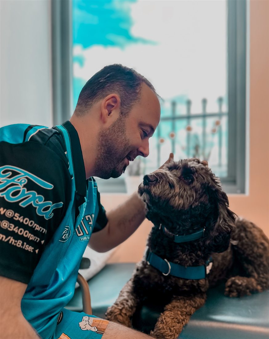 A participant sharing a quiet moment with his dog at home